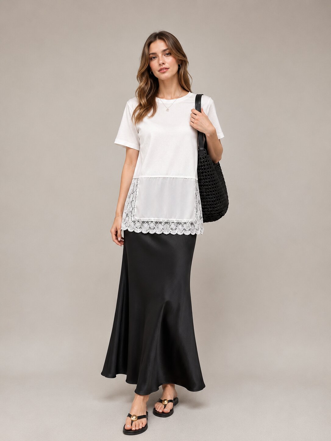 White lace-detail top styled with a long black skirt