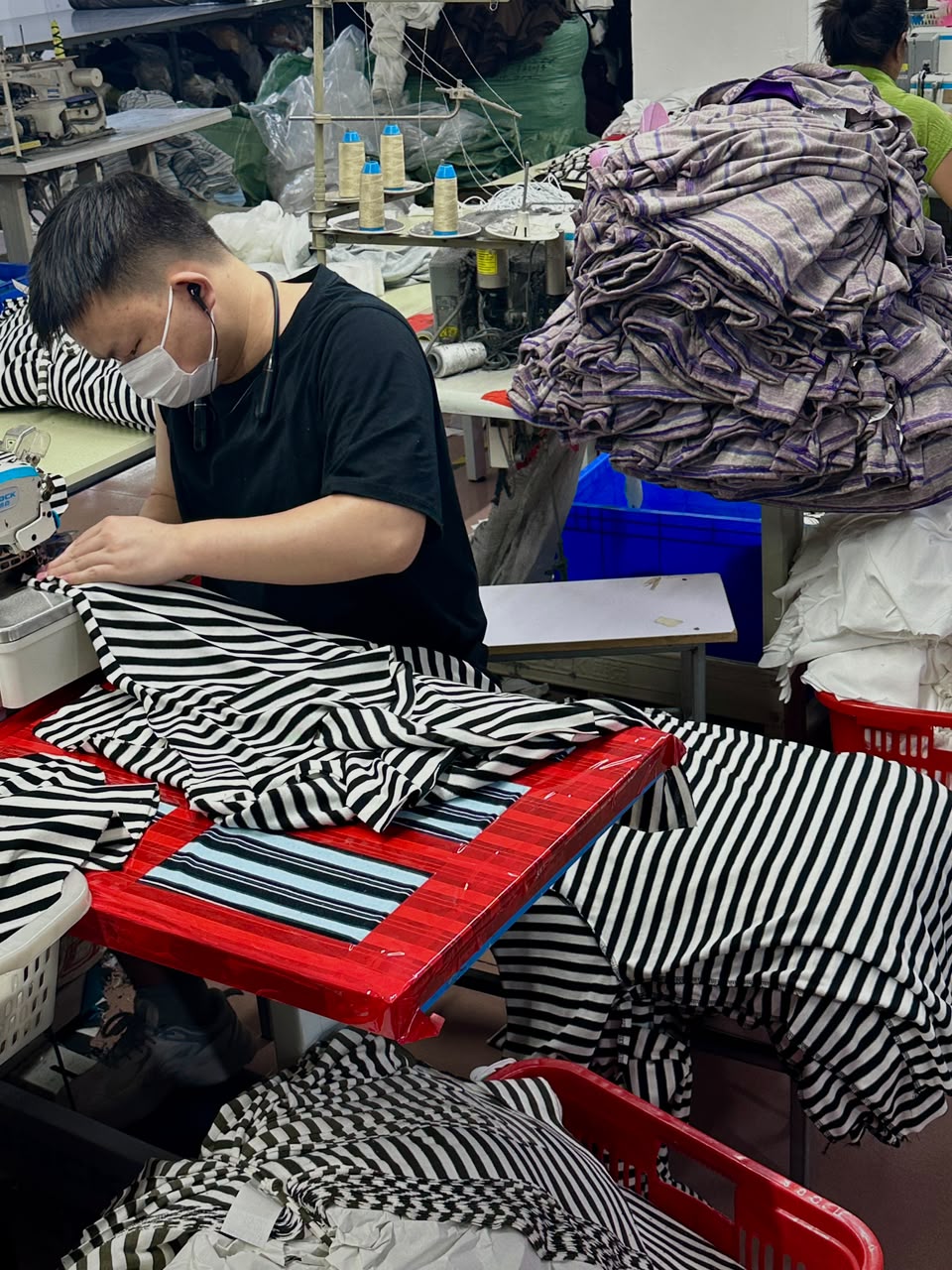UP NANQING production team sewing striped garments